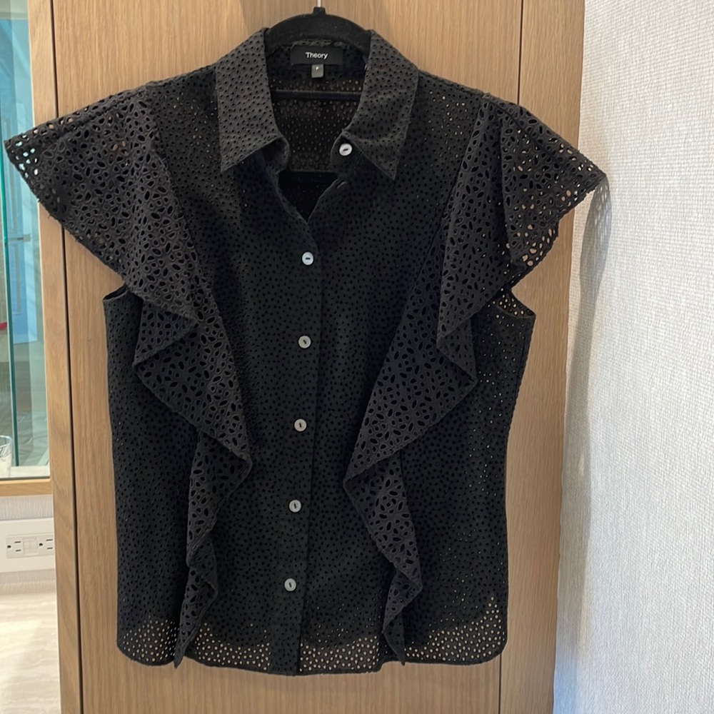 Theory black eyelet blouse with ruffle detail.